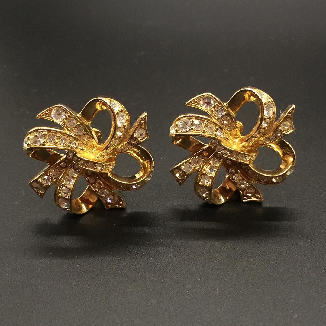 KJL gold tone ribbon rhinestone earrings