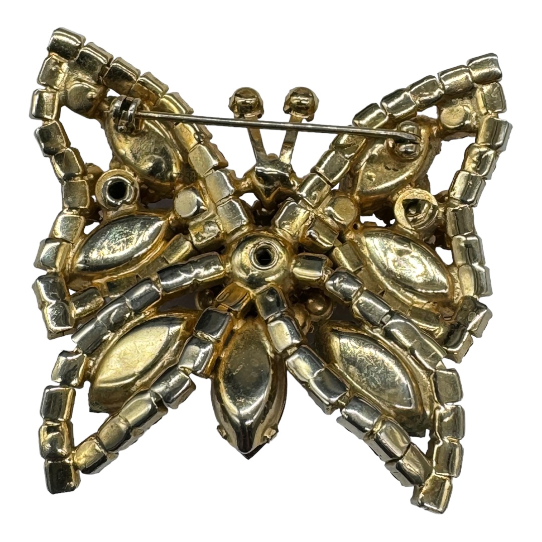 Vintage rhinestone butterfly brooch with cat eye navettes.