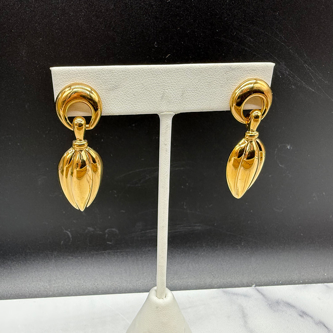 1990s Napier gold tone pierced pendant earrings.