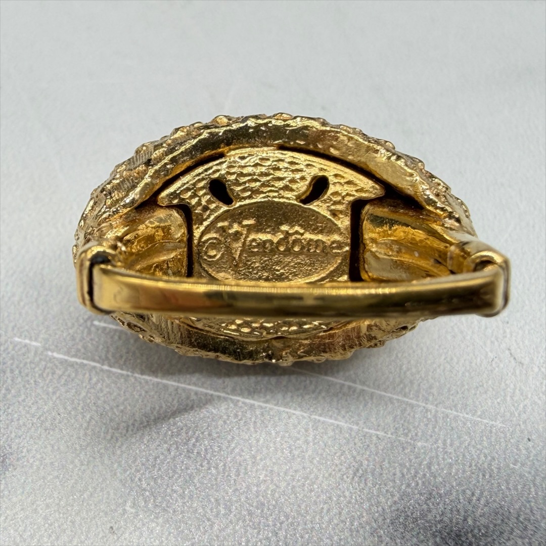 Vendome gold-tone textured ring mark.