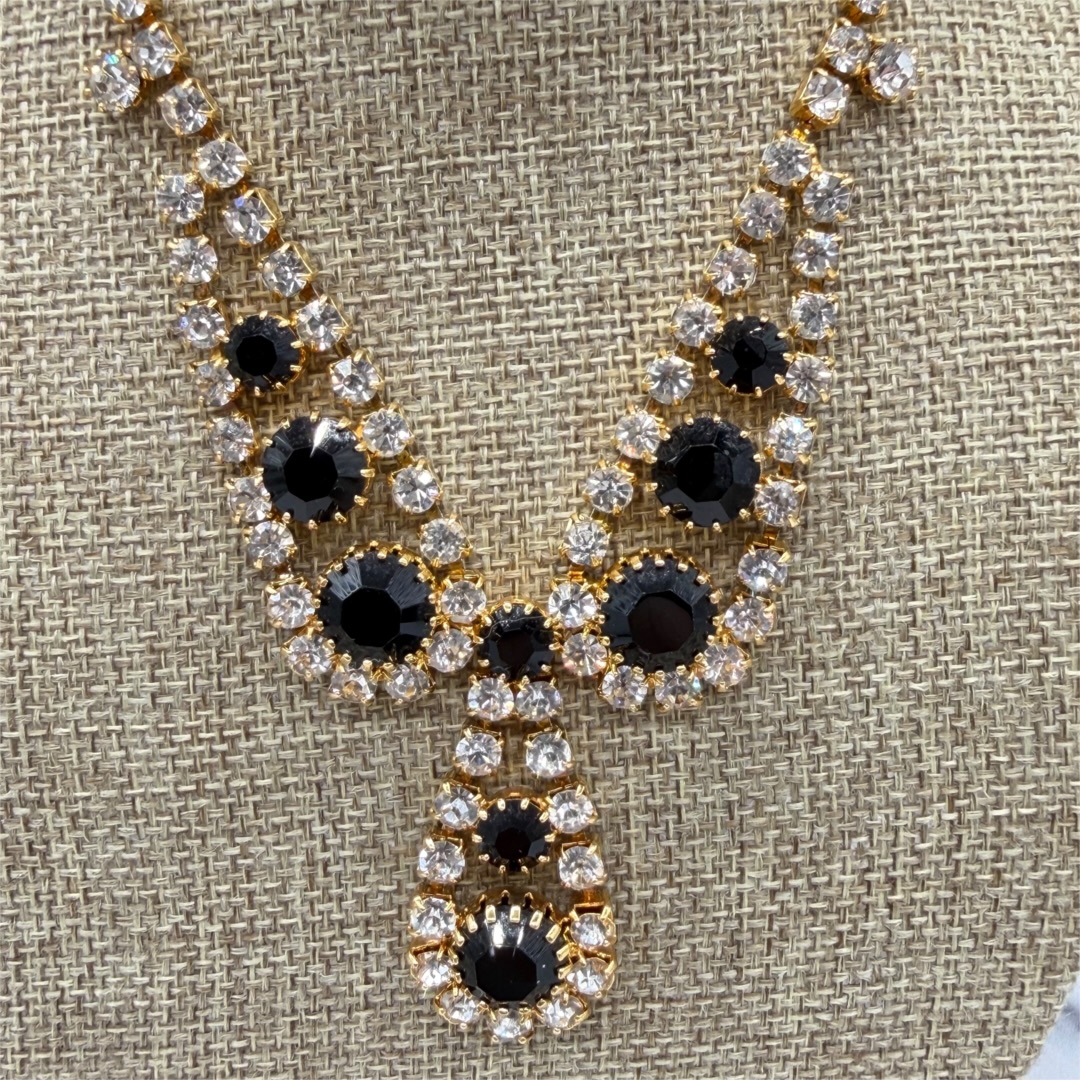 Vintage gold-tone black rhinestone necklace up close.
